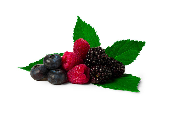 mix, of ripe berries, with leaves, scattered, on a white background, raspberries, blackberries, blueberries, food background, - Photo, Image