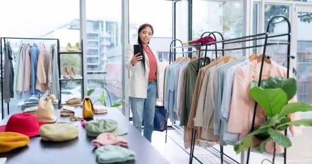Stylist, woman and video call with small business and designer fashion with choice in retail shop. Personal shopping, conversation and African female person in tailor boutique for customer on mobile. - Footage, Video
