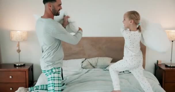 Pillow fight, child and dad play in bedroom with energy, funny games and tickle together at home. Excited girl kid, father and laughing with pillows, crazy morning and quality time of happy family. - Footage, Video