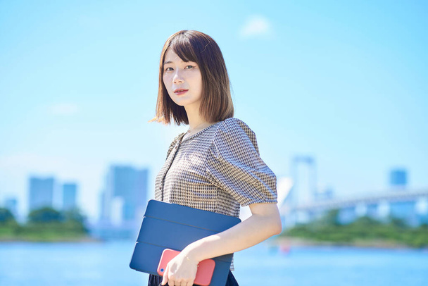 Portrait of a young business woman outdoors on fine day - Photo, Image