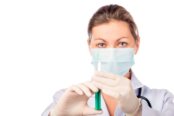 doctor wearing a mask and gloves with syringe - Foto, Imagen