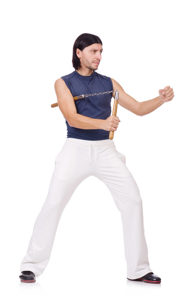 Αστεία μαχητής καράτε με nunchucks σε λευκό - Φωτογραφία, εικόνα