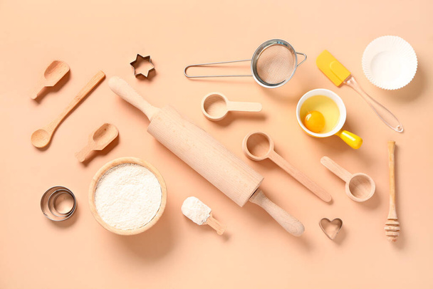 Baking utensils on beige background - Valokuva, kuva