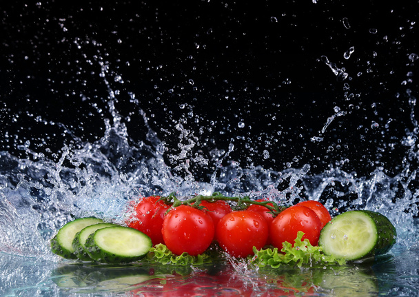 Salad, tomato and cucumber with water drop splash - Photo, Image