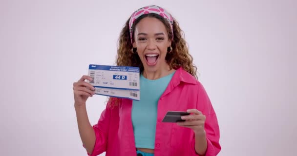 Happy woman, credit card and flight tickets in travel booking or payment against a studio background. Excited female person with airport documents, boarding pass or holiday getaway in online shopping. - Footage, Video