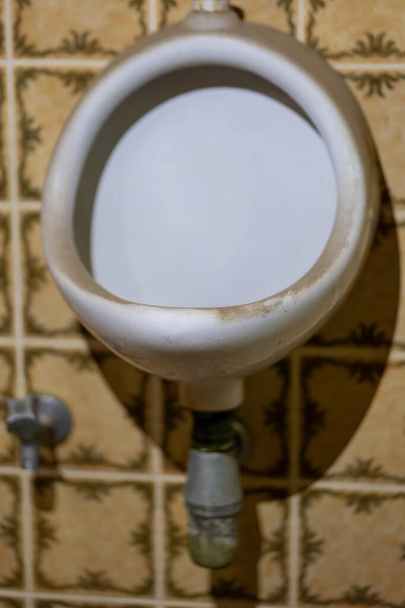 an old white dirty urinal in a lost place - Photo, Image