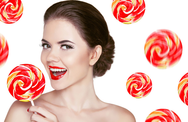 Happy smiling girl holding colorful lollipop isolated on white b - Fotoğraf, Görsel