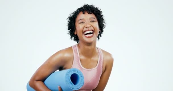 Woman, face and laughing, yoga and fitness with exercise mat, funny and happiness isolated on white background. Workout, training and comedy, yogi and wellness with health and pilates in a studio. - Footage, Video