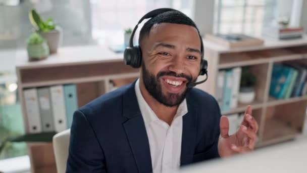 Call center, employee and man with telemarketing, speaking and ecommerce with tech support, crm and advice. Person, sales agent or consultant with customer service, headphones and help in a workplace. - Footage, Video