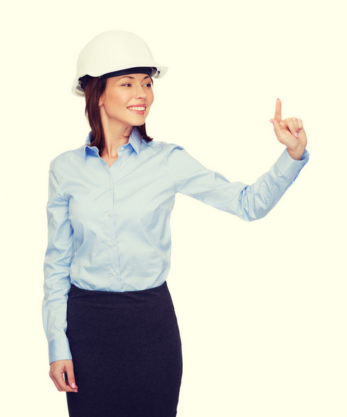 smiling businesswoman in white helmet - Fotó, kép