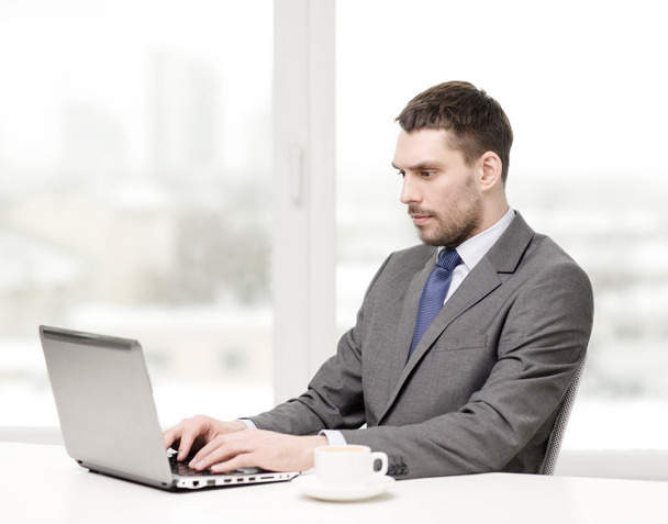 Busy businessman with laptop - Photo, Image