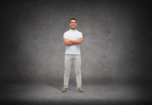 Smiling man   with crossed arms - Fotografie, Obrázek