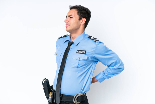 Young police caucasian man isolated on white background suffering from backache for having made an effort - Foto, Imagem