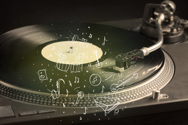 Turntable playing classical music with icon drawn instruments  - Fotografie, Obrázek