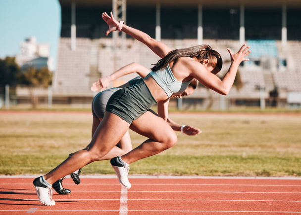 Action, sports and athlete running sprint in competition or fitness game or training for energy wellness on track. Race, stadium and athletic people or runner exercise, speed and workout performance. - Photo, Image