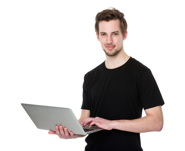 Young man with laptop - Фото, зображення