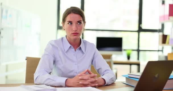 Tired female manager dozes at wooden desk with laptop and paperwork. Weary employee trying to meet deadlines on time in office slow motion - Footage, Video