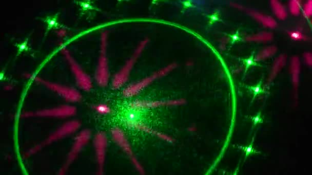 Flashing and flying animation patterns of pink and green colors on a black background - Footage, Video