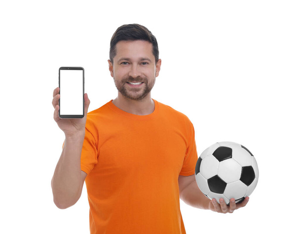 Happy sports fan with ball and smartphone on white background - Zdjęcie, obraz