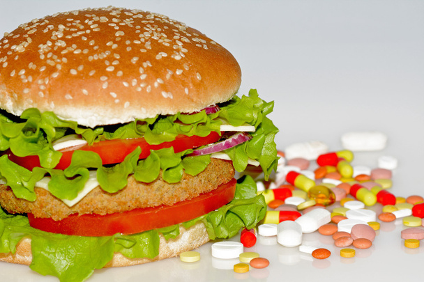 Comida rápida y pastillas
  - Foto, Imagen