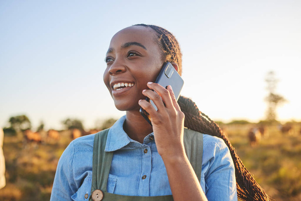Phone call, countryside and black woman with connection, agriculture and communication with a smile. Person outdoor, girl or farmer with a cellphone, conversation and ecology with nature and contact. - Photo, Image