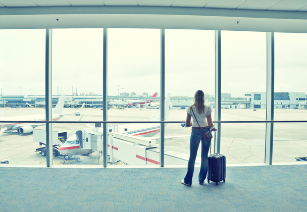 Girl at the airport window - Photo, Image