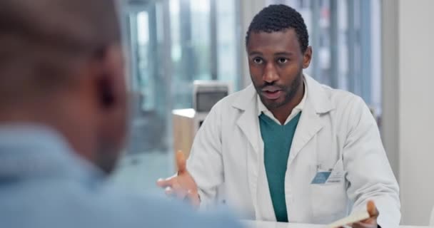 Results, test or doctor talking in consultation in hospital listening or speaking of medical diagnosis. Black man, history or African nurse in healthcare clinic helping a sick patient with documents. - Footage, Video