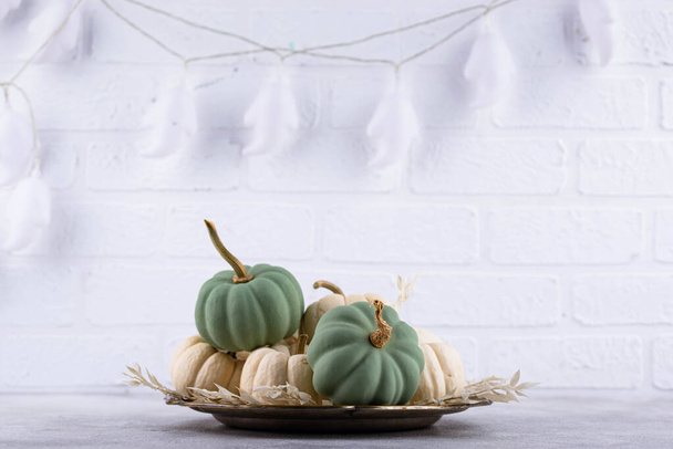 Elegant no scary Halloween decor with white pumpkin and skull - Foto, immagini