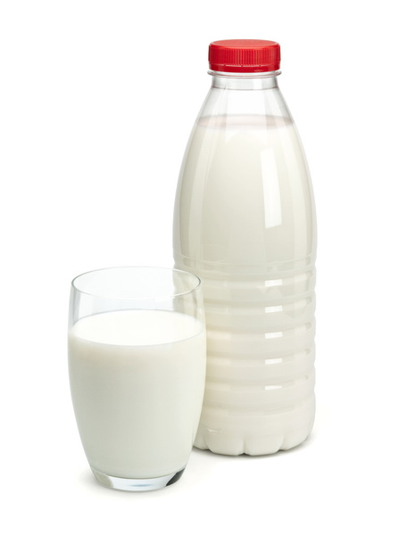 Milk in a plastic bottle and a glass - Foto, imagen