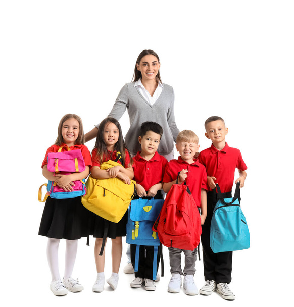 Malé školní děti s učitelkou na bílém pozadí - Fotografie, Obrázek