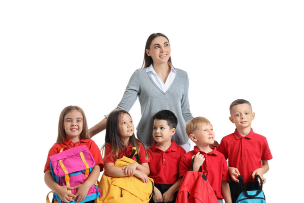 Pequenas crianças da escola com professora no fundo branco - Foto, Imagem