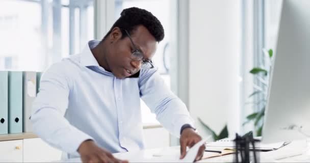 Phone call, productivity and businessman in the office planning a schedule with legal paperwork. Professional, writing notes and busy African male lawyer working on a mobile conversation in workplace. - Séquence, vidéo