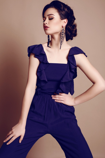  beautiful young woman with dark hair in elegant dark blue suit  - Fotoğraf, Görsel
