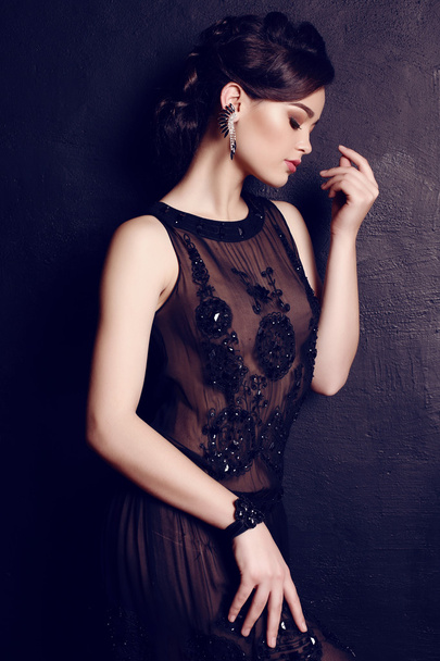 elegant woman with dark hair in luxurious black dress   - Photo, image