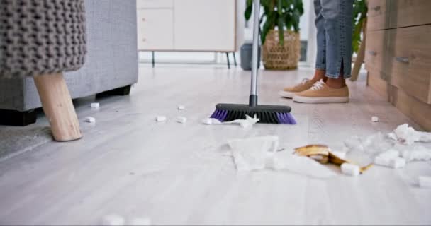 Broom, trash and closeup of woman sweeping in the living room of her modern apartment for hygiene. Equipment, dirt and zoom of female maid or cleaner cleaning the floor with dirt in lounge of a house. - Footage, Video