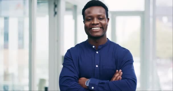 Face, business and black man with arms crossed, smile or consultant with confidence, happy or startup. Portrait, African person or entrepreneur with career, professional or employee in a workplace. - Footage, Video