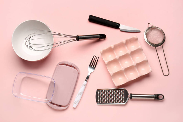 Set of kitchen utensils on pink background - Photo, Image