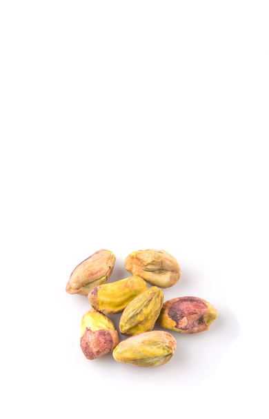Nueces de pistacho sobre fondo blanco
 - Foto, Imagen