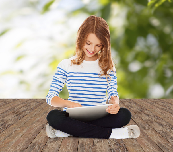 happy little student girl with tablet pc - Фото, изображение