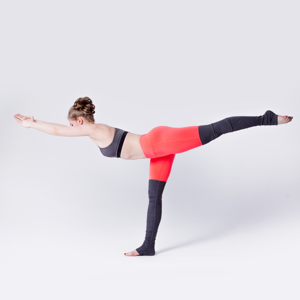 Woman balancing while, yoga poses - 写真・画像