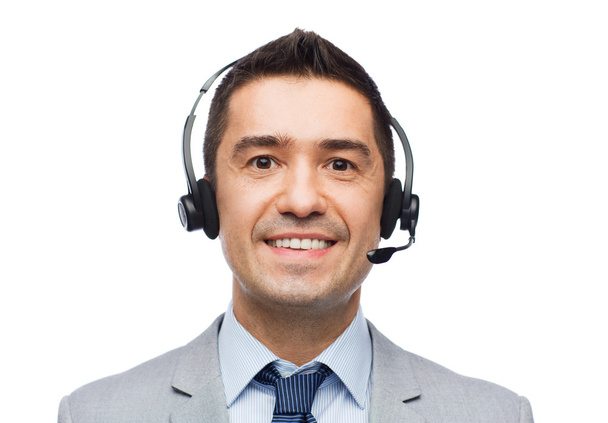 smiling businessman in headset - Photo, Image