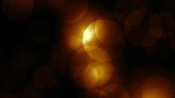 Abstract loop motion flickering orange bokeh rotation animation on black background. Blinking Glittering Particles Bokeh loop effect.  - Footage, Video