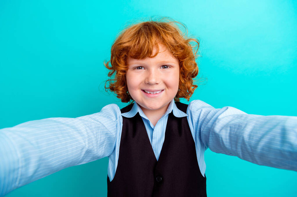 Photo portrait of adorable foxy wavy hair boy frontal camera selfie dressed stylish school outfit isolated on cyan color background. - Φωτογραφία, εικόνα