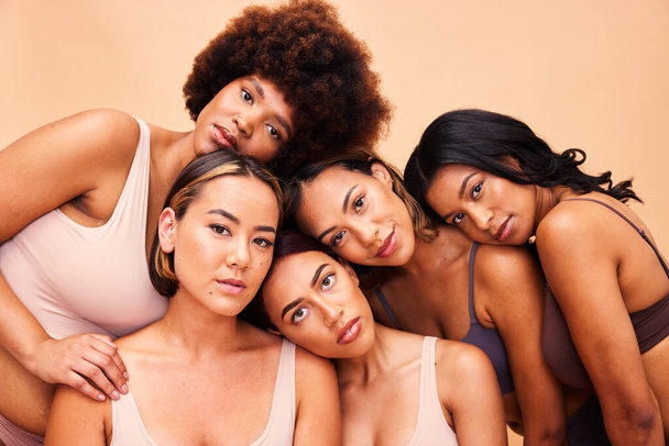 Beauty, group and portrait of women with makeup for cosmetic skincare isolated in a studio brown background. Diversity, aesthetic and young friends together for self care, dermatology and support. - Φωτογραφία, εικόνα