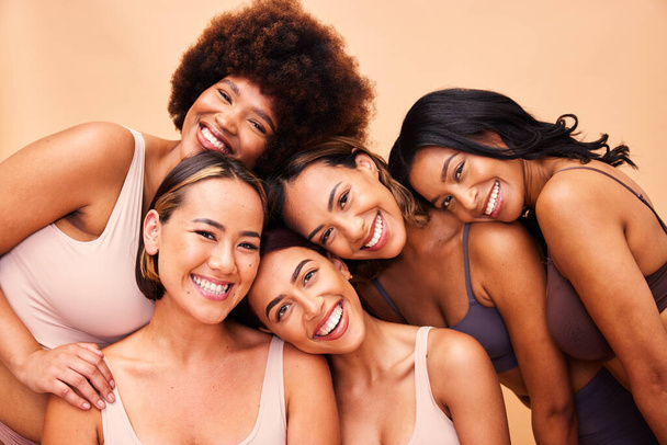 Beauty, diversity and portrait of women happy with makeup for cosmetic skincare isolated in studio brown background. Skin, aesthetic and young friends together for self care, dermatology and support. - Fotoğraf, Görsel