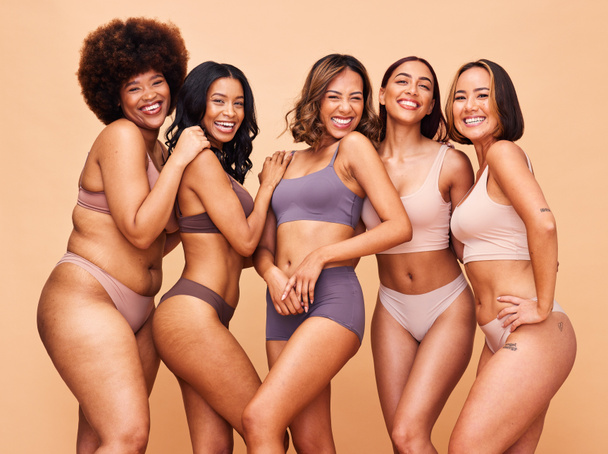 Self love, diversity and portrait of women in studio in underwear for wellness, beauty and body positive. Lingerie campaign, natural and people on brown background for pride, skincare and inclusion. - Zdjęcie, obraz