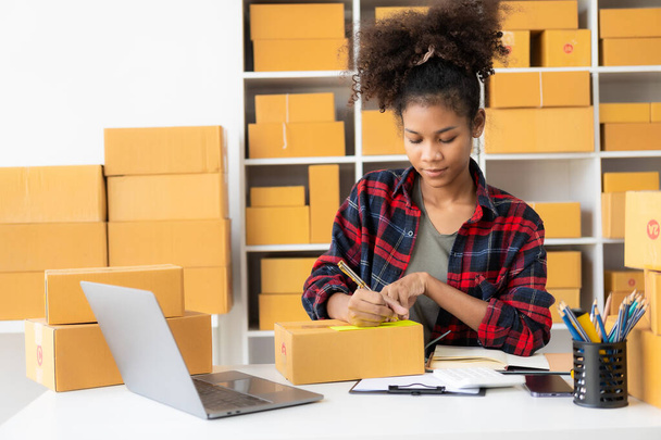 Entrepreneurs working from home Online shopping, ecommerce, internet banking, spending money, work from home ideas with parcel boxesSME business ideas - 写真・画像