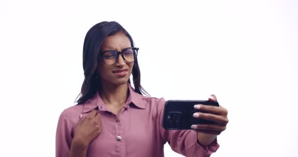 Phone, problem and woman in studio confused by glitch, 404 or connect fail on white background. Smartphone, stress or lady frustrated by phone call, scam or phishing, crisis or online communication. - Footage, Video