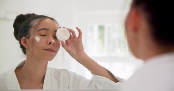 Face cream, mirror and woman kiss, smile and happy with skincare, application and results at home. Beauty, sunscreen and female with emoji lips in a bathroom for wellness, dermatology or satisfaction. - Footage, Video