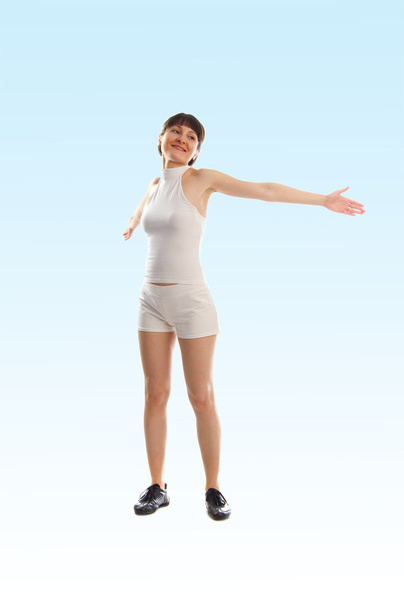 Attractive young brunette girl doing active exercises - Foto, afbeelding